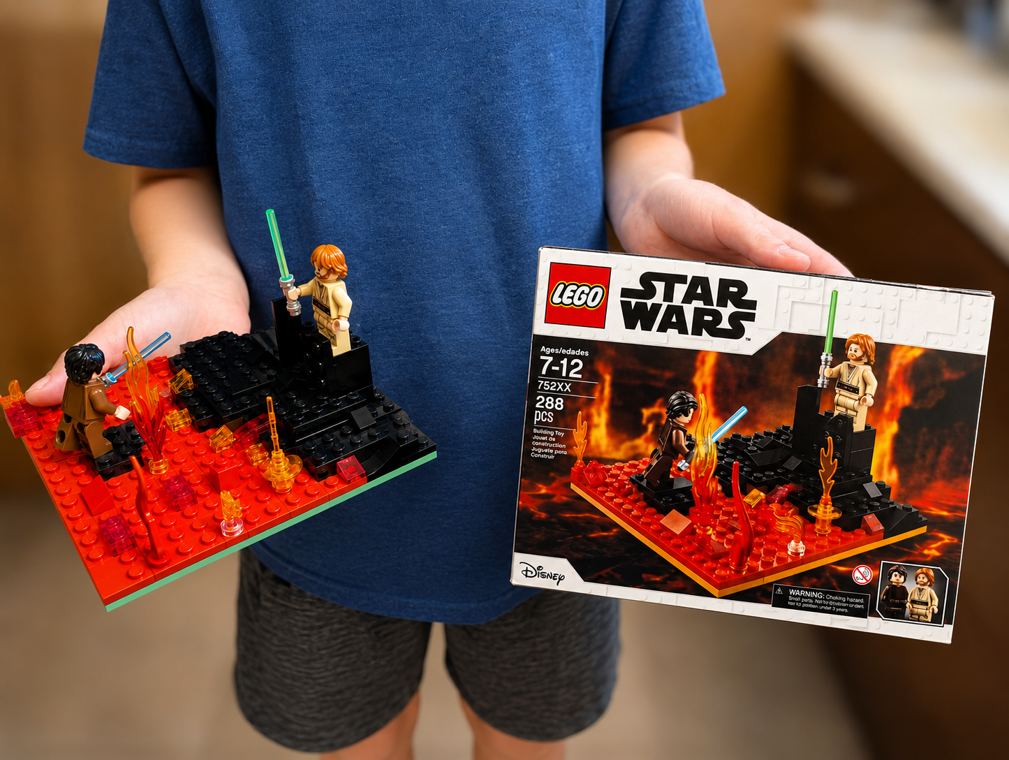 A kid holding a custom-built LEGO lava battle scene next to a matching custom-printed LEGO box